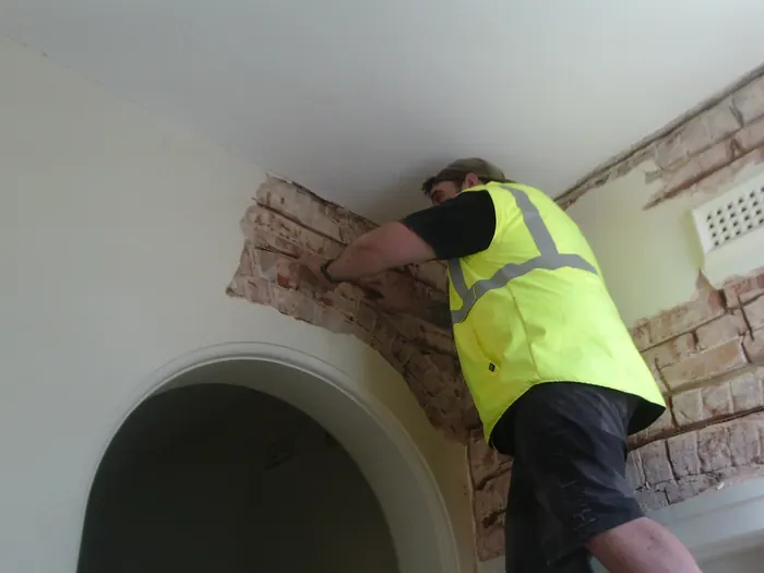 Bowsan installer carrying out Helifix stitching inside a home